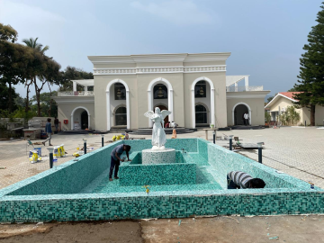 Resort-style swimming pool at French Town Coimbatore featuring elegant tiling.