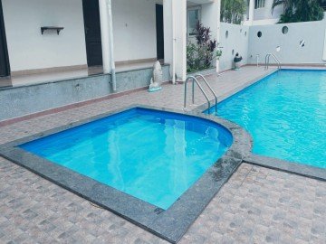 A close-up of water droplets in a fountain highlighting the mist and refreshing atmosphere.